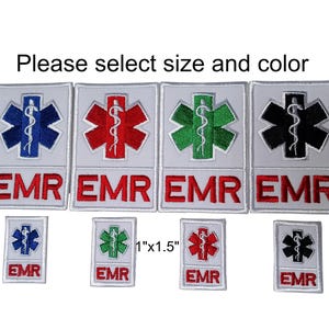 May include: A set of iron-on patches featuring the medical symbol of a snake wrapped around a staff, a star of life, and the letters "EMR". The patches are available in four colours: blue, red, green, and black. The patches are available in two sizes: 2 inches by 3 inches and 1 inch by 1.5 inches.