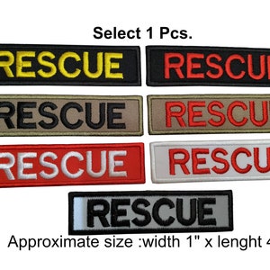 Könnte beinhalten: Sechs gestickte Patches mit dem Wort "RESCUE" in verschiedenen Farben und Schriftarten. Die Patches sind etwa 2,5 cm breit und 10 cm lang. Wählen Sie 1 Stück.