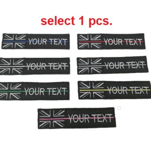 May include: Set of eight black and white embroidered iron-on patches featuring the Union Jack flag with a thin colored stripe across the middle. The patches have the text "YOUR TEXT" printed on them. The colors of the stripes are red, blue, green, yellow, and pink.