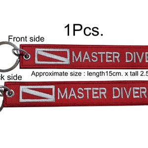 May include: Red embroidered keychain tag with the words "MASTER DIVER" in white. The tag is approximately 5.9 inches long and 1 inch tall. The tag has a metal keyring attached.