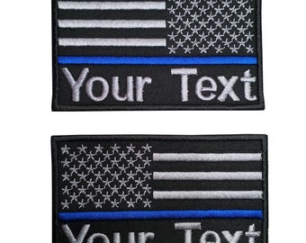 1 st. Anpassat namn USA flagga tunn blå linje polisswat Vanliga Revers USA flagga tygmärke krok baktill för fastsättning eller sy på storlek 9 cm x 5,5 cm.