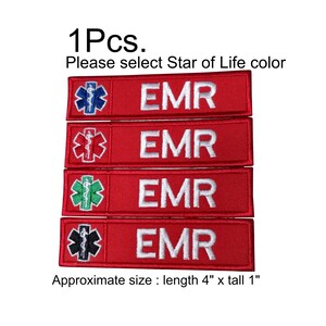 Puede incluir: Cuatro parches EMR rojos con diferentes símbolos de la Estrella de la Vida: azul, rojo, verde y negro. Cada parche tiene la palabra "EMR" en blanco. El tamaño aproximado es de 10 cm de largo y 2,5 cm de alto.