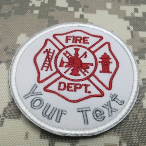 May include: White embroidered patch with a red fire department logo. The logo features a fire hydrant, an axe, a ladder, and the words "FIRE DEPT". The patch has the text "YOUR TEXT" below the logo.