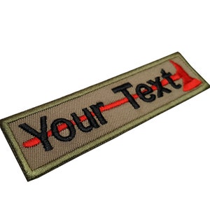 May include: A tan embroidered patch with a red axe and the text "Your Text" in black.