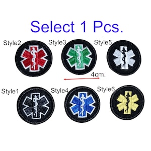 May include: Six different styles of 4 cm medical symbol patches. The patches are embroidered with a red, green, white, blue, yellow, and black medical symbol on a black background.  Select 1 Pcs.