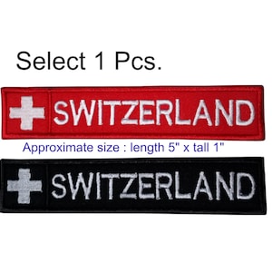 May include: Two embroidered patches with the Swiss flag and the word "SWITZERLAND" in white lettering. The top patch is red with white lettering and the bottom patch is black with white lettering. The patches are approximately 5 inches long and 1 inch tall.