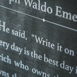 May include: Black chalkboard with white text that reads "Ralph Waldo Emerson" and "He said, "Write it on your hat every day is the best day in the".