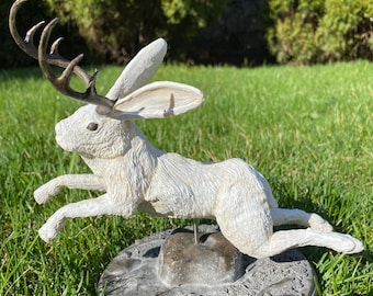 Jumping jackalope statue