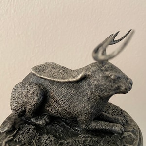 Jackalope mini statue in “catloaf” pose