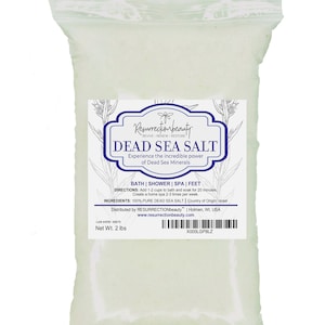 May include: A white resealable plastic bag filled with white Dead Sea Salt. The bag has a label with the text "Resurrectionbeauty" and "Dead Sea Salt" in black text. The label also includes directions for use and ingredients. The bag is 2 lbs.