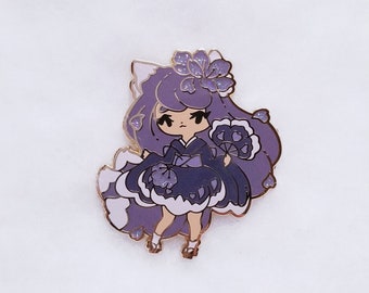 May include: Purple enamel pin featuring a cartoon character wearing a kimono and holding a fan. The character has long purple hair, a flower on her head, and a white fluffy tail.