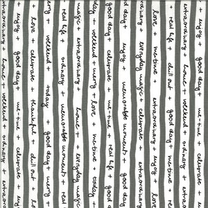 May include: Black and white striped fabric with handwritten text on each stripe. The text includes phrases like "good day", "love", "celebrate", "weekend", "extraordinary", "real life", "magic", "me-time", "memorable moments", "everyday", "today", "thankful", "chill out", "merry", and "enjoy".