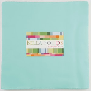 May include: A solid turquoise fabric swatch with a Bella Solids Moda label. The label has a colorful geometric pattern.