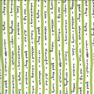May include: Green and white striped fabric with the words "good day", "love", "celebrate", "extraordinary", "weekend", "ordinary", "real life", "me-time", "today", "magic", "everyday", "memorable moments", "chill out", "thankful", "very", "enjoy", "syg", "use-time" written in black.