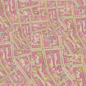 May include: A vintage map of New York City with a pink background and blue and yellow markings. The map shows the streets of the Lower East Side, including Mulberry Street, Pell Street, and Bayard Street. The map also shows the location of a public school.