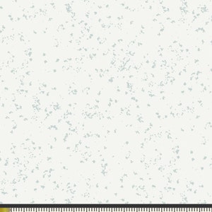 May include: White fabric with a light blue speckled pattern. The fabric is shown with a ruler measuring 8 inches.