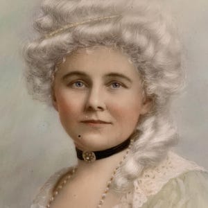 May include: A portrait painting of a person with blue eyes and pale skin, wearing a tall, powdered white wig styled in curls. The subject wears a black choker with a central circular ornament, a pearl necklace, and a light green garment with lace.