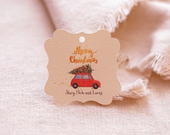 May include: A beige Christmas gift tag with a red car carrying a Christmas tree. The tag says "Merry Christmas" and "Stacy, Nick, and Lucas".