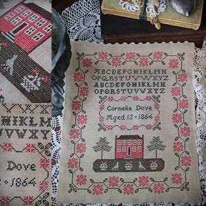May include: A beige cross-stitch sampler featuring a red and green house, trees, and flowers. The sampler includes the alphabet, the name "Cornelia Dove", and the date "Aged 12 - 1864".