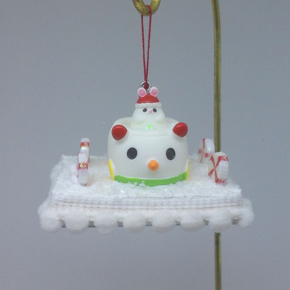 Miniature Snowman Ornament titled Snowmobile