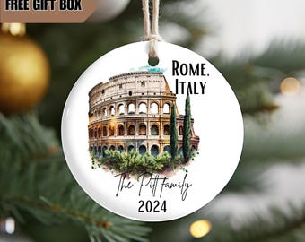 May include: White ceramic Christmas ornament with a watercolor illustration of the Colosseum in Rome, Italy. The ornament also includes the text "Rome, Italy" and "The Pitt family 2024".