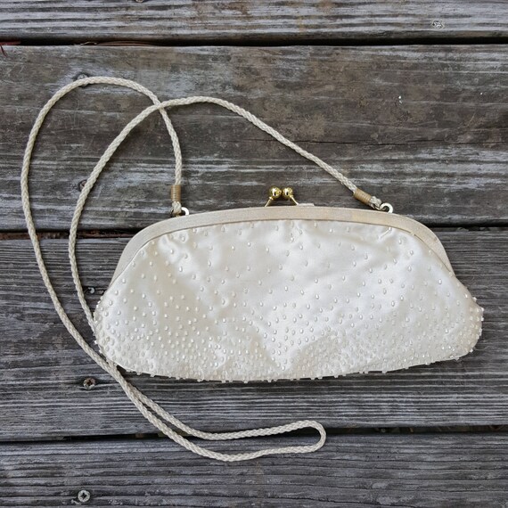 white beaded clutch bag