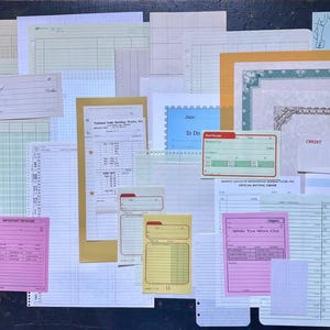 May include: A collection of vintage office stationery including various ledger sheets, grid paper, lined forms, and memo pads in shades of white, cream, yellow, pink, and green. Several items feature printed text such as Just An Update, Credit, and To Do.