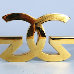 The Gold Gods Figural Logo Gold Metal Paperweight Gucci Like