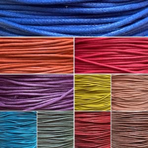 May include: A collection of 10 spools of waxed cotton cord in various colours, including blue, orange, red, purple, yellow, pink, turquoise, grey, and brown.