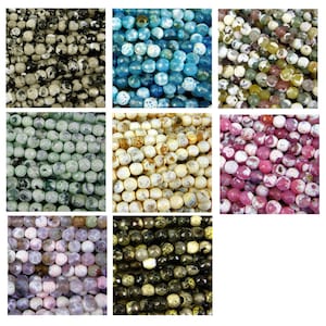 May include: Assortment of 10mm round agate beads in various colours and patterns, including black and white, blue, green, cream, pink, and brown.