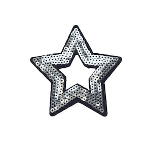 May include: A silver star-shaped patch with sequins. The star is outlined in black.