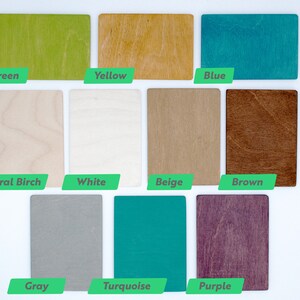 May include: A set of 10 wood samples in different colors and finishes, including green, yellow, blue, natural birch, white, beige, brown, gray, turquoise, and purple.