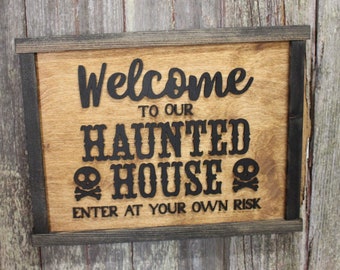 Welcome to Our Haunted House Sign Skull Crossbones Enter at Your Own Risk Halloween Scary 3D Raised Text Country Farmhouse Cabin Wood Decor