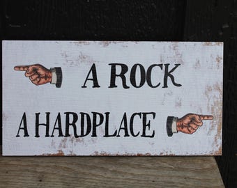 A Rock A Hard place Hands Arrows Textured PVC UV Printed Outdoor Weather Proof Rustic Funny Play On Words Sign Rectangle Signage