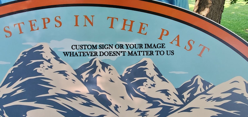 May include: A blue and white sign with the text "Steps in the Past" and the text "Custom sign or your image whatever doesn't matter to us". The sign features a graphic of three mountains.