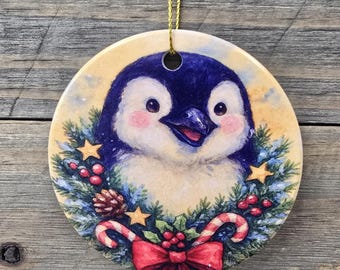 Festive Penguin wearing a Wreath printed on a Ceramic Ornament for Holiday decor, gift or tree