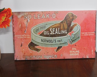 Vintage No-Leak-O Piston Rings Sign: Rustic Man Cave Garage Decor