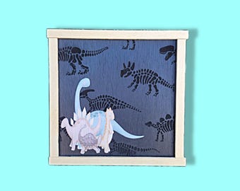 Printed Dinosaur Sign • Layered Kids Wall Art • Mixed‑Media Fossil Background with Colorful 3D Dinos