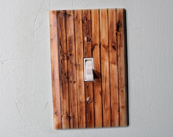 knotty pine pallet wood barnwood with warn painted paint chips light switch cover plate farmhouse decor rustic cedar