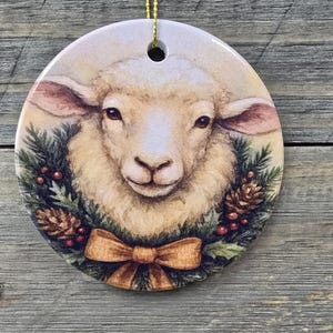 Festive Sheep wearing a Wreath Printed on a Ceramic Ornament for your Christmas Tree and Holiday Decor
