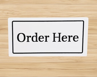 Order Here Sign – Bold Black Lettering on White for Café, Restaurant, Food Truck, or Small‑Business Counter Decor
