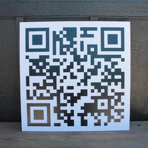 May include: A black and white QR code on a white background.