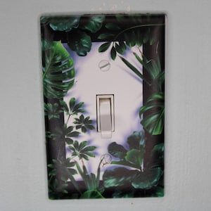 deep green forest jungle houseplants palm monstera leaves plants light switch plate cover printed durable green decor unique custom piece