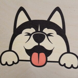 May include: A black and white cartoon illustration of a dog peeking over a surface with its tongue sticking out. The dog has a happy expression and is looking at the viewer.