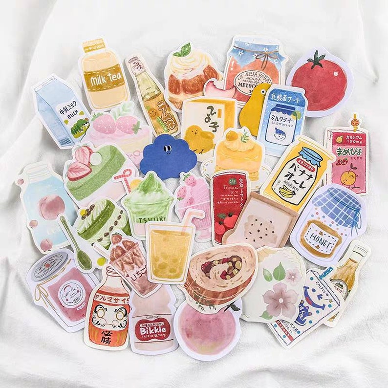 May include: A collection of colorful stickers featuring various food and drink items, including milk cartons, fruit, pastries, and beverages. The stickers are illustrated in a cartoon style with a whimsical and playful aesthetic.