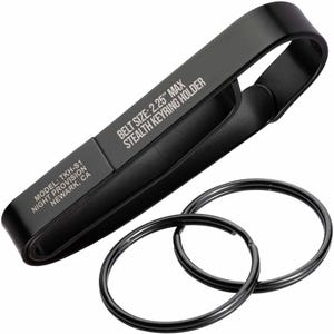 May include: Black metal key chain holder with two key rings. The holder is engraved with the text "MODEL: TKH-S1 NIGHT PROVISION NEWARK, CA BELT SIZE: 2.25" MAX STEALTH KEYRING HOLDER".