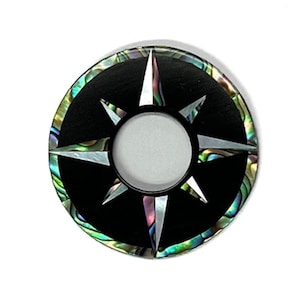 Op de afbeelding: Zwarte schakelaarplaat met een stervormig ontwerp van parelmoer. De plaat is ontworpen om te passen op een Les Paul gitaar. De tekst "SP13" is zichtbaar in de linkerbenedenhoek van de afbeelding.