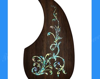 May include: Rosewood guitar pickguard with a decorative inlay of a floral design in iridescent blue, green, and white. The pickguard is shaped like a teardrop and is designed to fit a Martin D28 guitar.