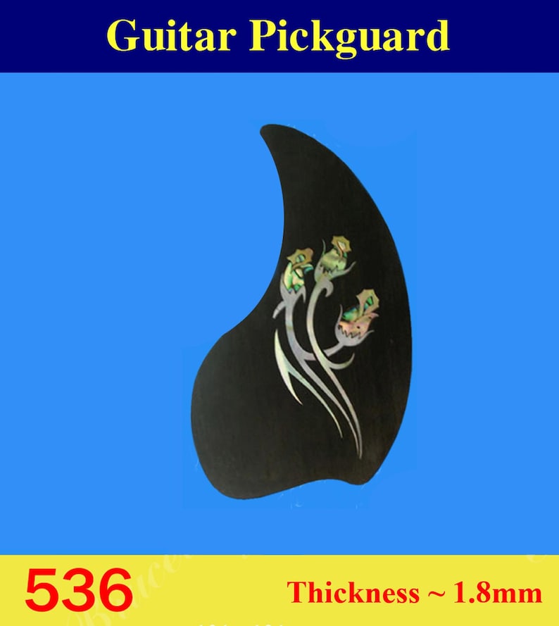 May include: Black guitar pickguard with a floral design in abalone shell. The pickguard is shaped like a teardrop and has a thickness of 1.8 mm. The pickguard is labeled with the number 536.