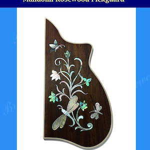 May include: A dark brown wooden mandolin pickguard with a floral design and dragonfly inlay. The inlay is made of mother of pearl and features a light blue and white color scheme. The pickguard is labeled "Mandolin Rosewood Pickguard".